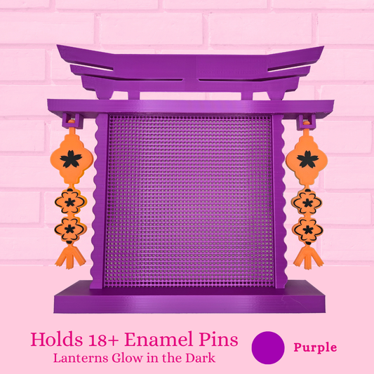 Purple with orange glow in the dark lanterns Japanese Arch enamel pin board and the words holds 18+ enamel pins.
