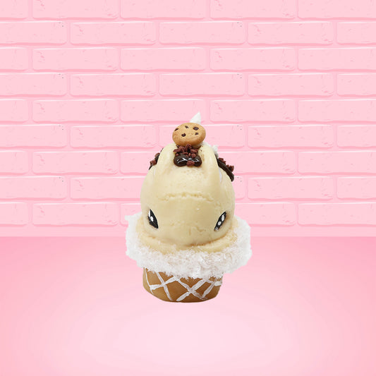 Cute kawaii bunny Cookie Dough ice cream cone with chocolate pieces and drizzle on top of the bunny as well as a cookie near the whipped cream swirl. This view is from the front.