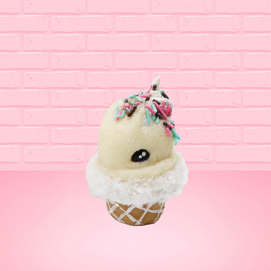 Cute kawaii bunny white ice cream cone with pink, teal, and black sprinkles on top of the bunny near the whipped cream swirl. The view is from the front at an angle.