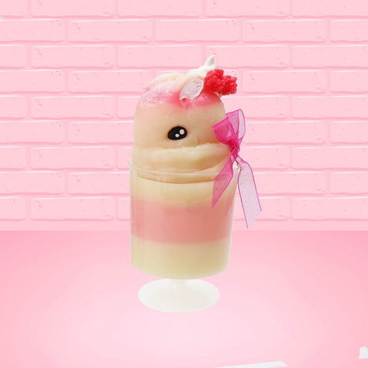 Cute kawaii bunny Raspberry Cheesecake white tall sundae with raspberries and a whipped cream swirl on top and a pink bow on the side. The bunny has glittery pink ears. This view is from the side at an angle.
