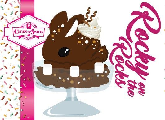 Cute kawaii bunny Rocky on the Rocks character card front, which has the digital artwork of the character, the name as Rocky on the Rocks, with the cotton tail sweets logo. The artwork shows rocky on the rocks ice cream brown sundae with marshmallows. The bunny sundae has two swirls of solid chocolate that stick up and a swirl of whipped cream is on the back. There are white and light brown sprinkles over the bunny.