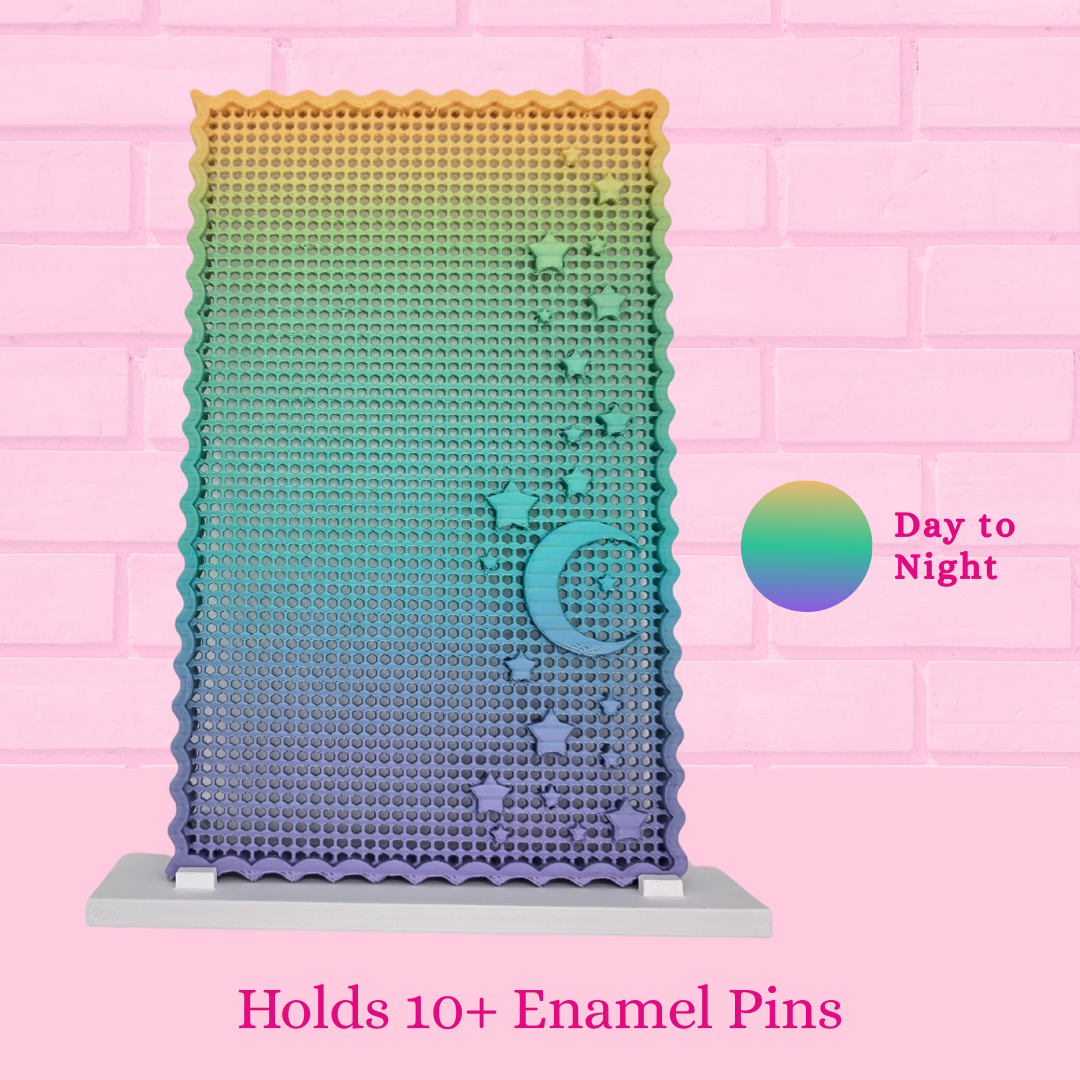 Day to Night Moon and Star display board with the words holds 10+ enamel pins
