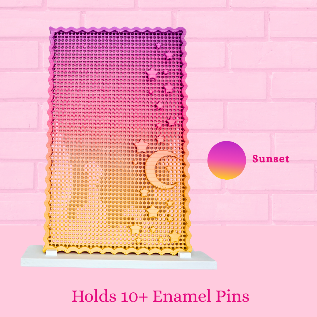 Sunset Moon and Star display board with the words holds 10+ enamel pins.