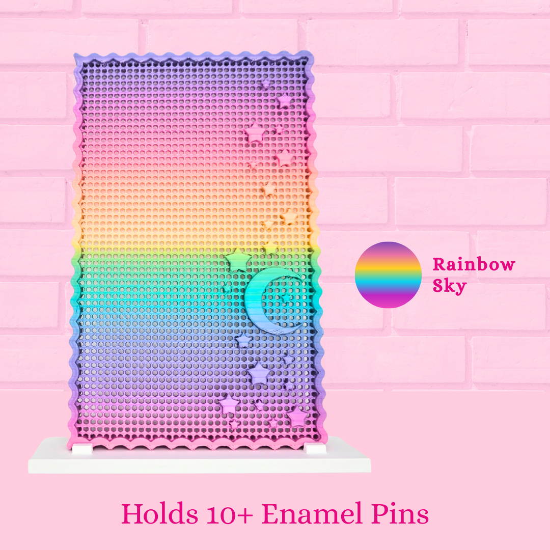 Rainbow Sky Moon and Star display board with the words holds 10+ enamel pins.