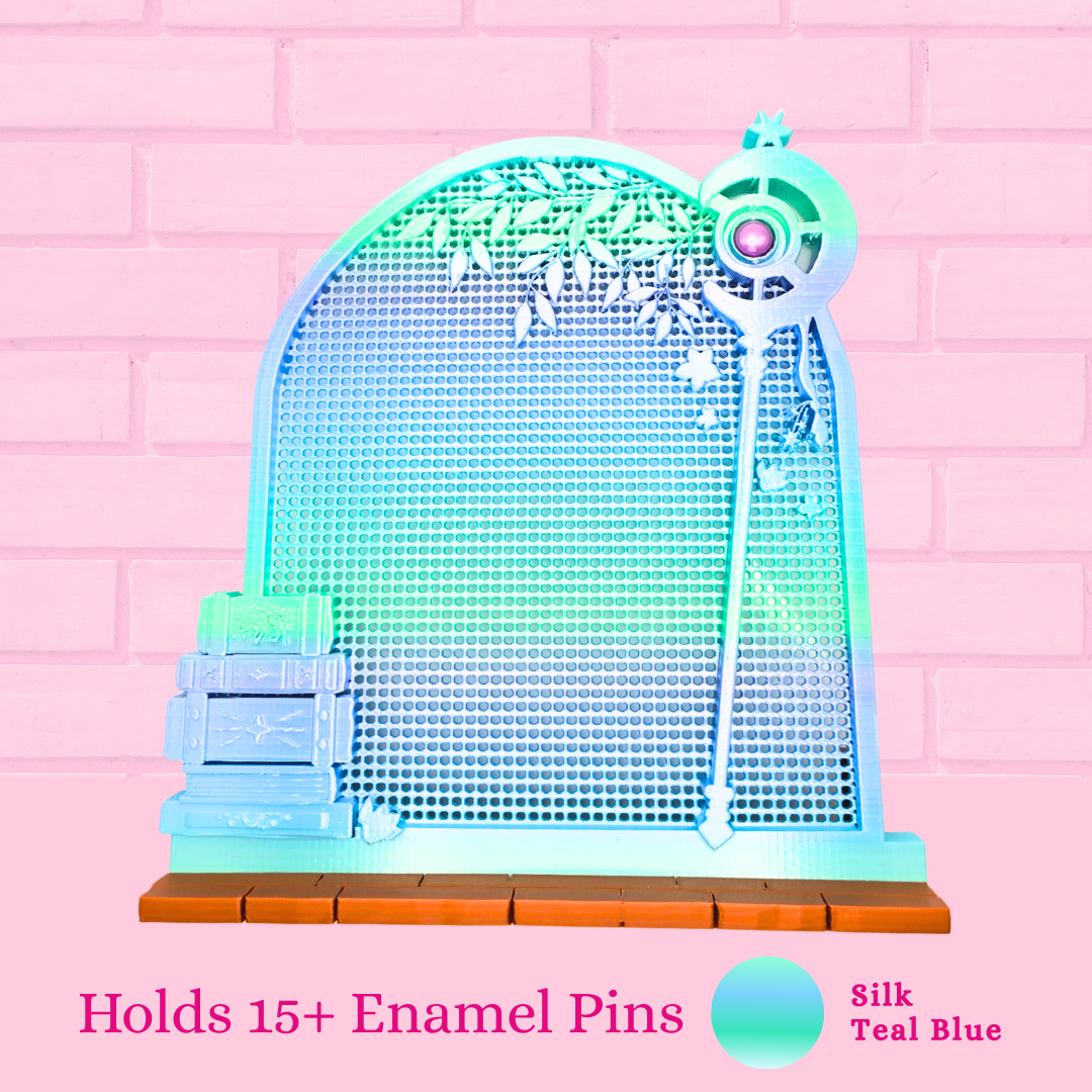 Silk Teal Blue Frieren Room enamel pin board with the words holds 15+ enamel pins.