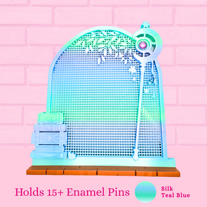 Silk Teal Blue Frieren Room enamel pin board with the words holds 15+ enamel pins.