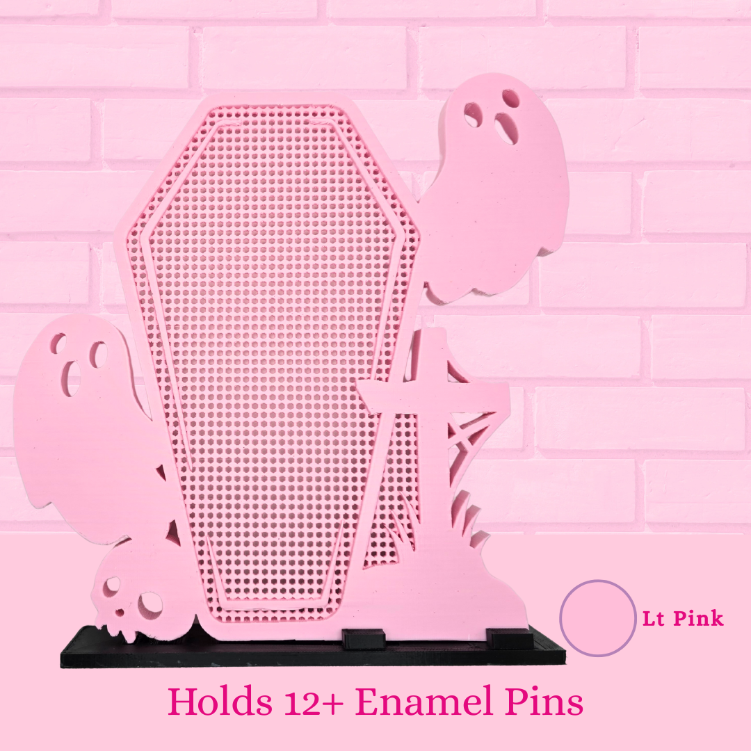 Light Pink Ghost Coffin with Skull/Cross enamel pin display board is shown with words holds 12+ enamel pins.