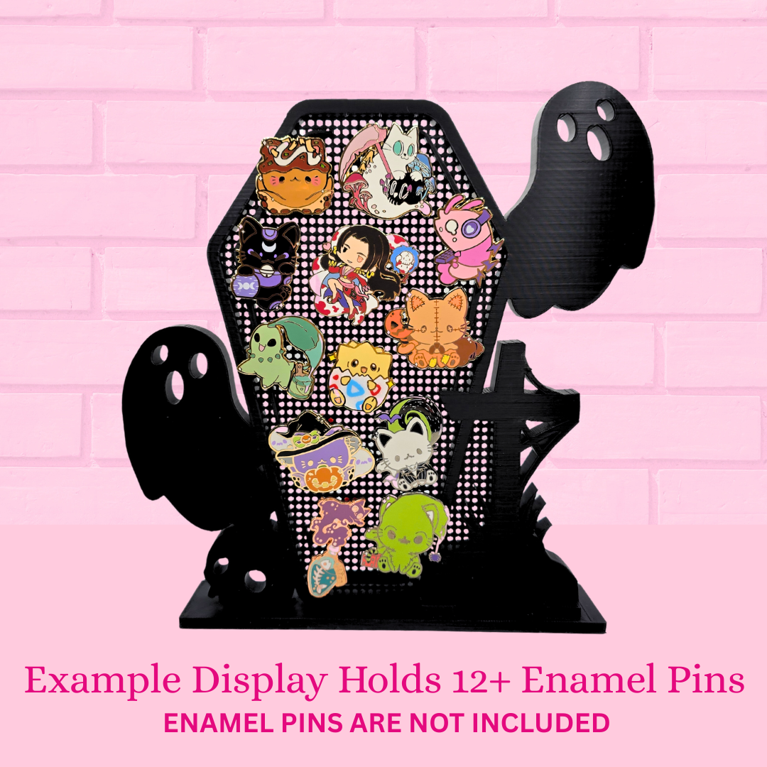 Example display Ghost Coffin with Skull/Cross with 12 enamel pins, with the words Example display holds 12+ enamel pins, enamel pins are not included.