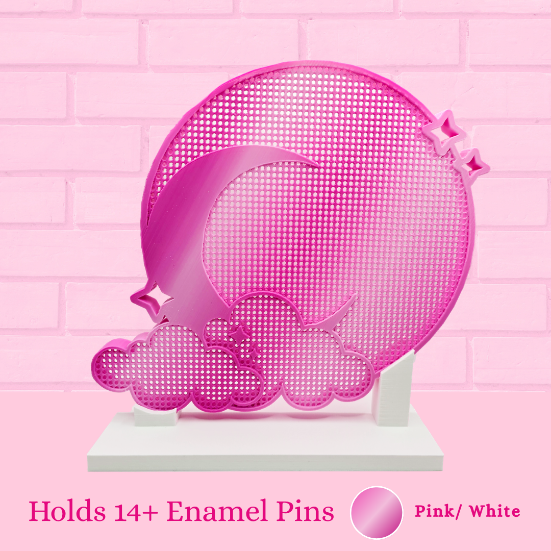 Pink and white, Moon and Clouds enamel pin board, with the words Holds 14+ enamel pins.