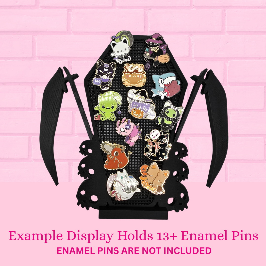 Example Scythe Coffin with Skulls enamel pin board with 13 pins with the words Example display holds 13+ enamel pins, enamel pins are not included.