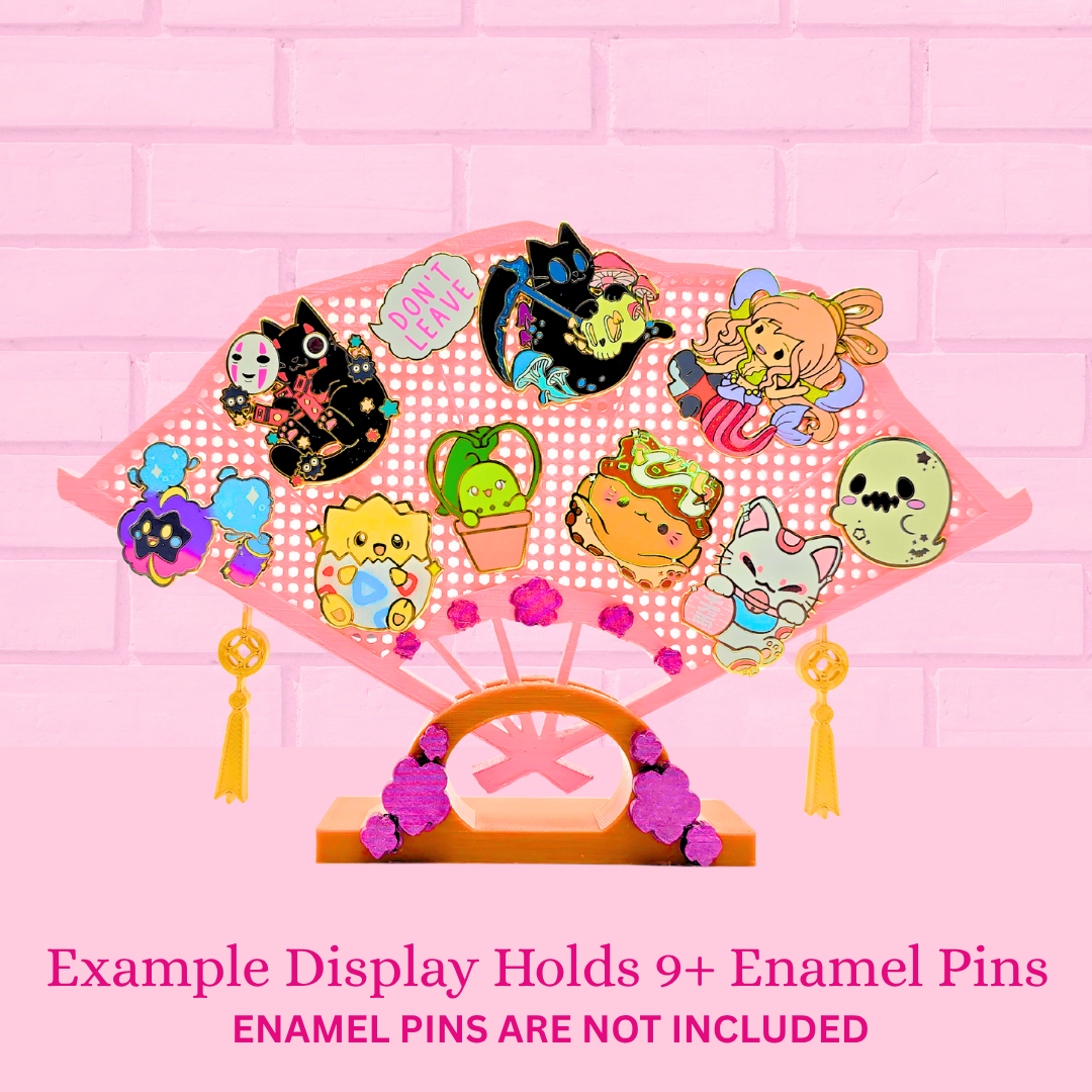 Example Display with 10 pins, with the words Example Display holds 9+ enamel pins, Enamel pins are not included.
