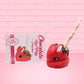 Cute kawaii red bunny with chocolate drizzle and nuts on the back of the bunny, with a finger stick in the back. 