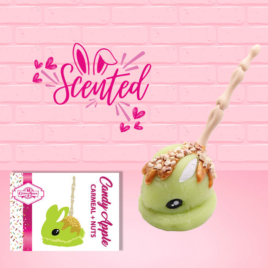Cute kawaii green bunny with caramel drizzle and nuts with a boney finger stick.  The front of the character card and scented are shown.