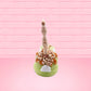 The back of the figure is shown.