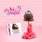 Cute kawaii brown bunny with white drizzle and coco bits on top of a wooden stick. The front of the character card is shown.