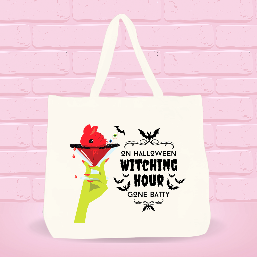 A Halloween tote bag with the bloody cranberry design that reads: On Halloween Witching Hour Gone Batty.