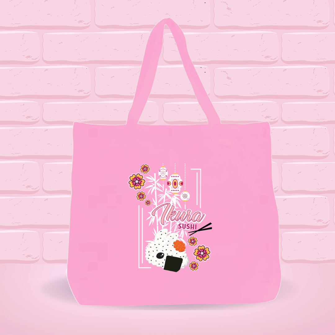 A pink canvas tote bag with the Ikura Sushi Bunny Design on it.