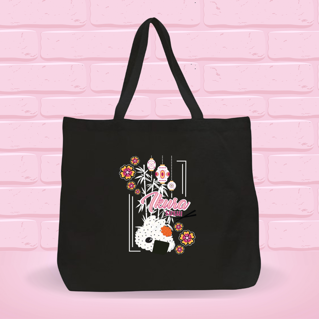 A black canvas tote bag with the Ikura Sushi Bunny Design on it.
