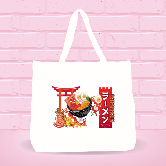 White tote bag with Smoked Pork Shack Ramen Bunny bowl design, japanese text and text on a pink brick wall background.