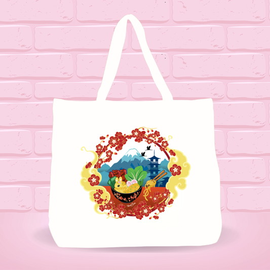 White tote bag with Sunny Golden Cream Ramen Bunny bowl design scenery on a pink brick wall background.