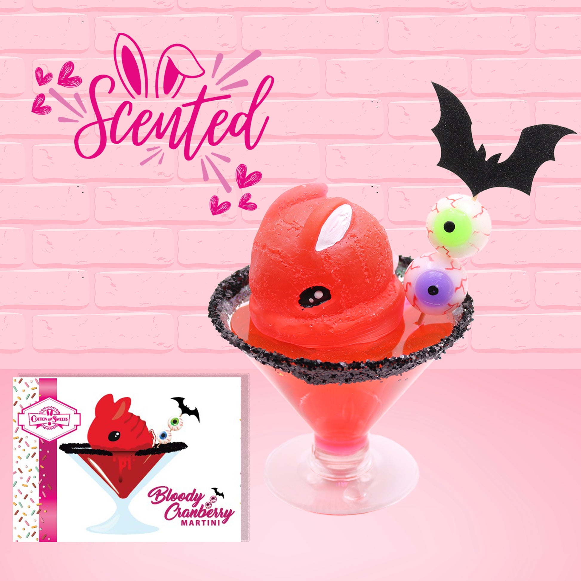 Cute kawaii red bunny with black frosted lip, and a skewer with two eyeballs and a bat. The front of the character card is shown as well as the word scented.