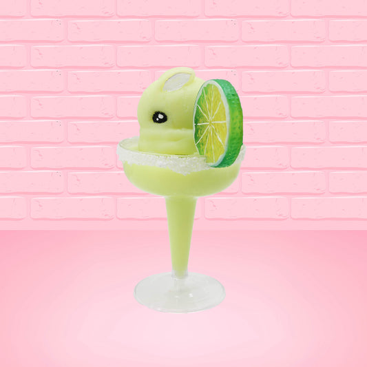 Cute kawaii green bunny drink Chilled Lime Margarita in a margarita glass with a salted rim, and a lime slice attached to the rim. The view is from the side.