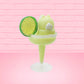 Cute kawaii green bunny drink Chilled Lime Margarita in a margarita glass with a salted rim, and a lime slice attached to the rim. The view is from the back.