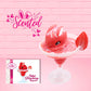 Cute kawaii red bunny in a frosted dish with a slice of strawberry on the rim. The front of the character card is shown, as well as the word scented.