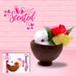 Cute kawaii white bunny in a coconut with red flowers, pineapples and pink umbrella.  The front of the character card as well as the word scented is shown.