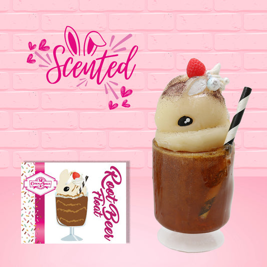 Cute kawaii bunny Root Beer Float white bunny in a brown drink with a black and white straw on the side. The bunny has a strawberry, brown glitter, silver pearls, on top next to the swirl of whipped cream. The front of the character card is shown as well as the word scented.