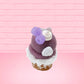 Cute kawaii bunny Blackberry Cobbler Dazzle with white glitter and purple raspberries on top near the swirl of whipped cream. This view is from the back.