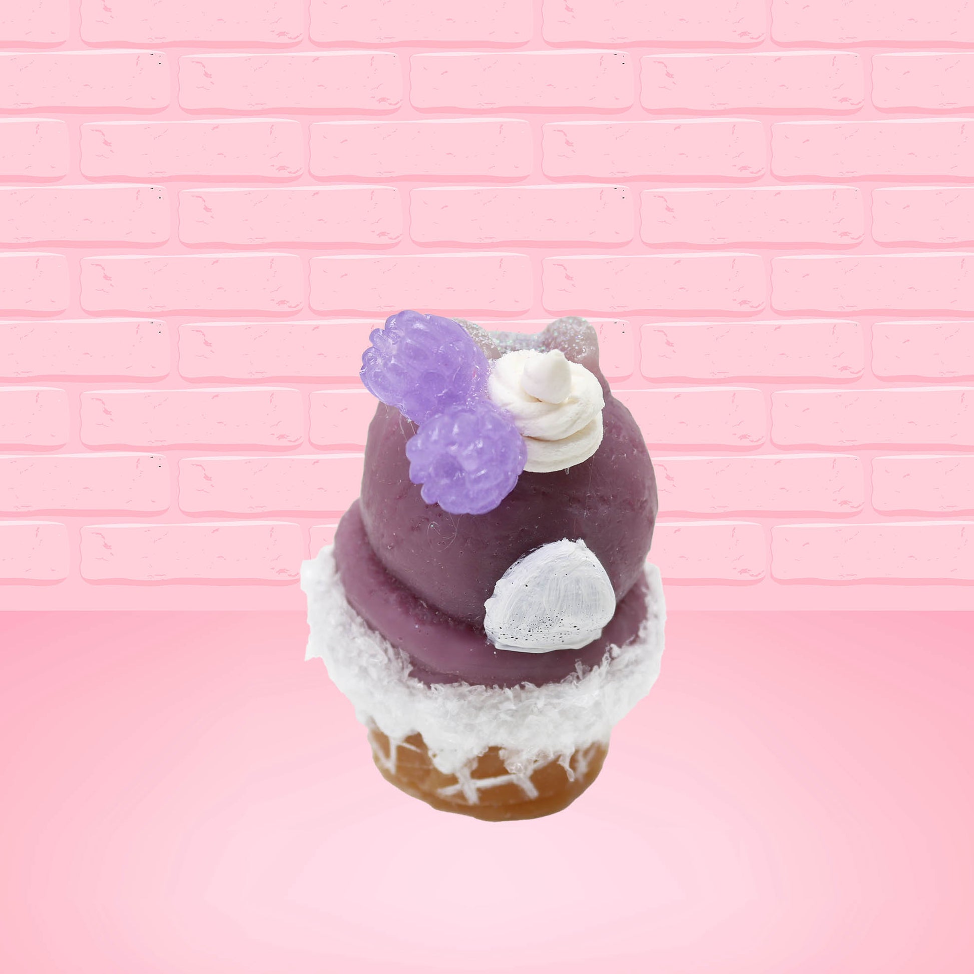 Cute kawaii bunny Blackberry Cobbler Dazzle with white glitter and purple raspberries on top near the swirl of whipped cream. This view is from the back.