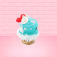 Cute bunny kawaii Blue Razz Star Blast blue ice cream with red raspberries, silver pearls and clear stars on the top of the bunny near the whipped cream swirl. This view is from the back at a different angle.