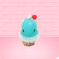 Cute bunny kawaii Blue Razz Star Blast blue ice cream with red raspberries, silver pearls and clear stars on the top of the bunny near the whipped cream swirl. This view is from the front.