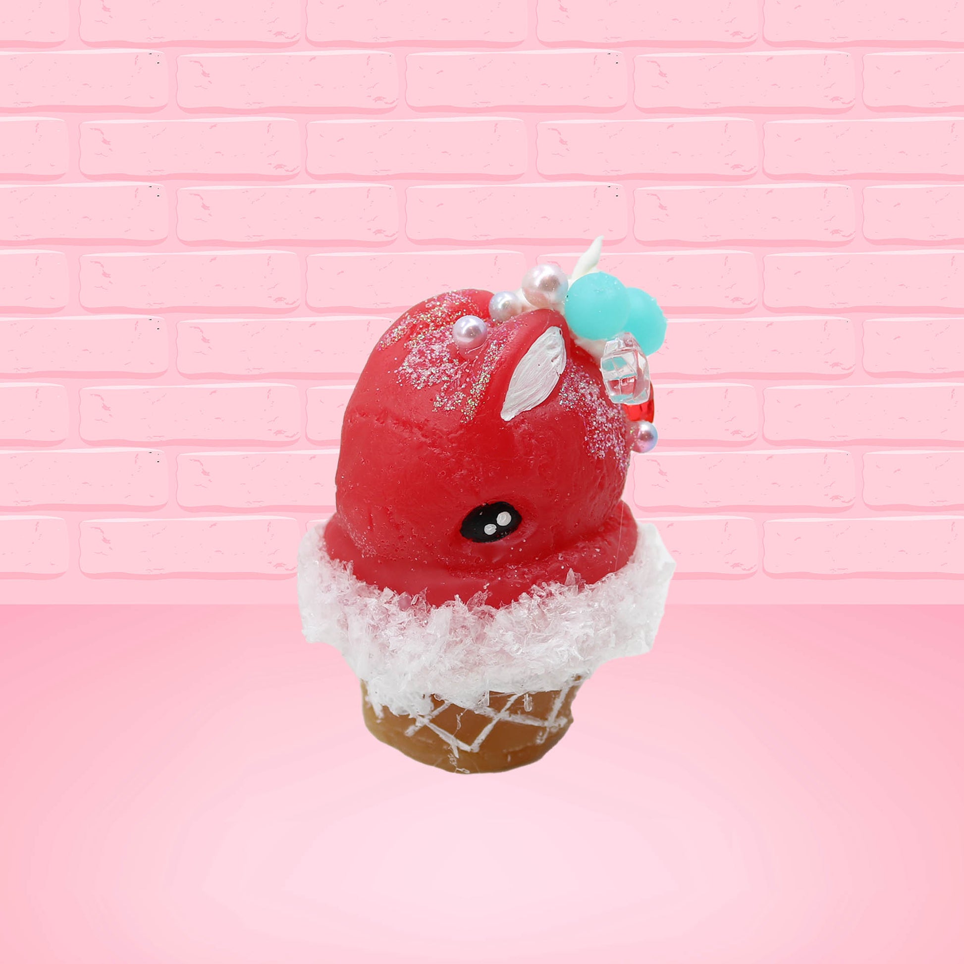 Cute kawaii bunny Cherry Star Blast red ice cream with light blue blueberries, silver pearls, and a clear star near the swirl of whipped cream on the top. This view is from the front at an angle.