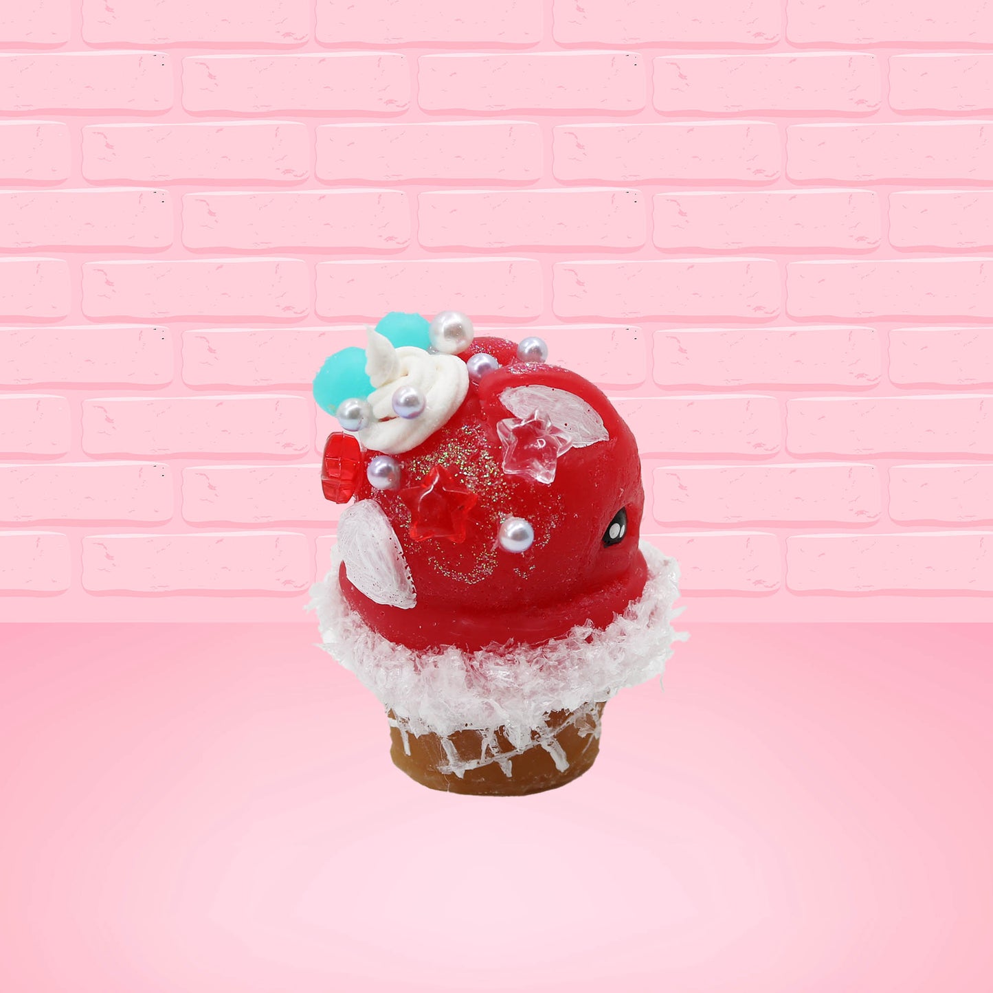Cute kawaii bunny Cherry Star Blast red ice cream with light blue blueberries, silver pearls, and a clear star near the swirl of whipped cream on the top. This view is from the other side.