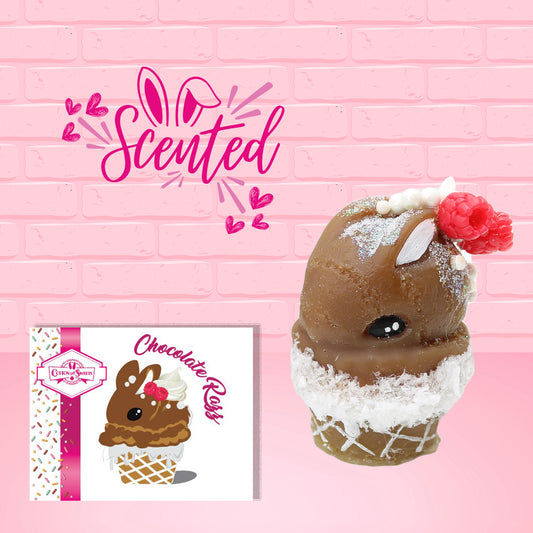 Cute kawaii bunny chocolate ice cream cone with glitter and red raspberries on top of the bunny near the swirl of whipped cream. The front of the character card is shown as well as the word scented.