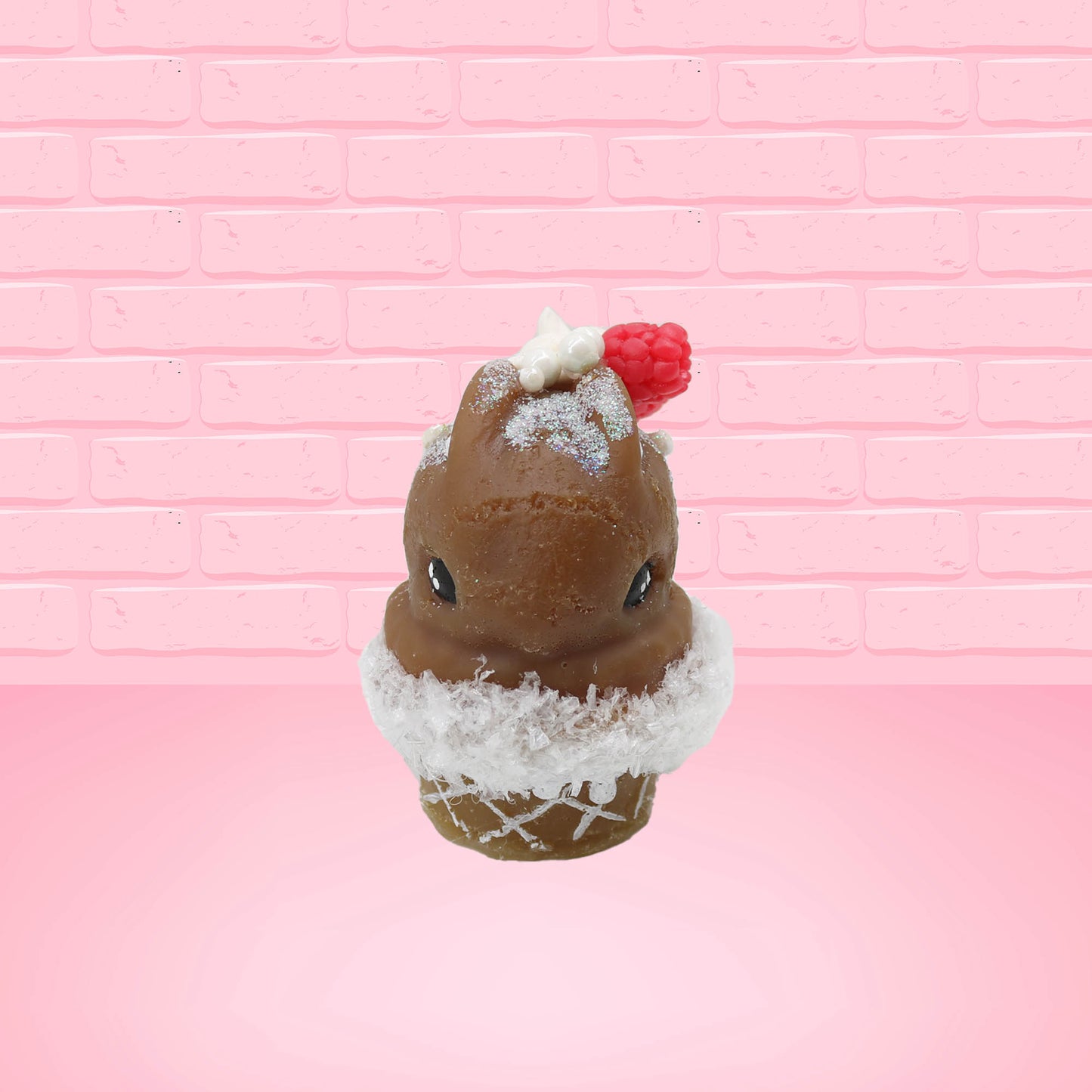 Cute kawaii bunny chocolate ice cream cone with glitter and red raspberries on top of the bunny near the swirl of whipped cream. This view is from the front.