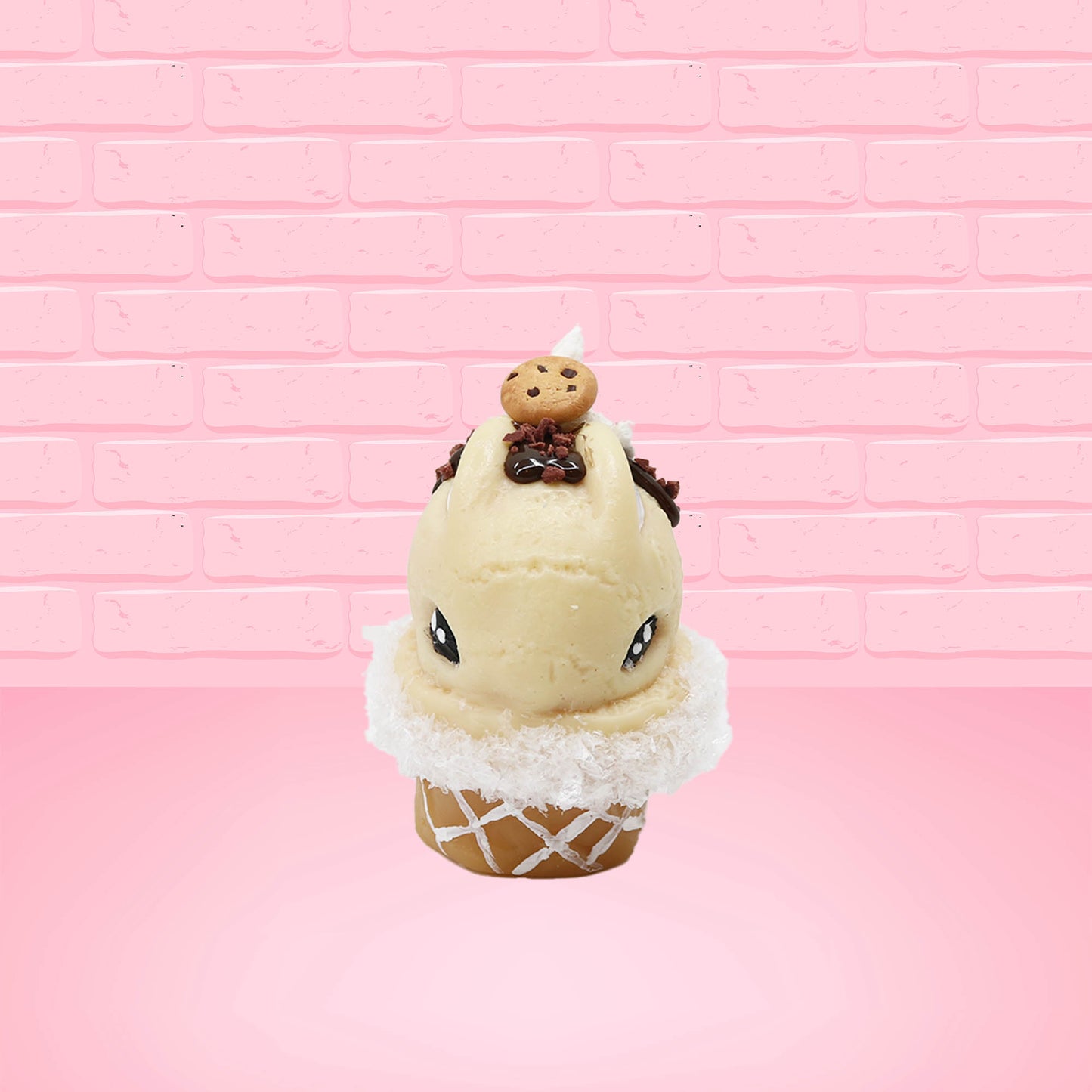 Cute kawaii bunny Cookie Dough ice cream cone with chocolate pieces and drizzle on top of the bunny as well as a cookie near the whipped cream swirl. This view is from the front.