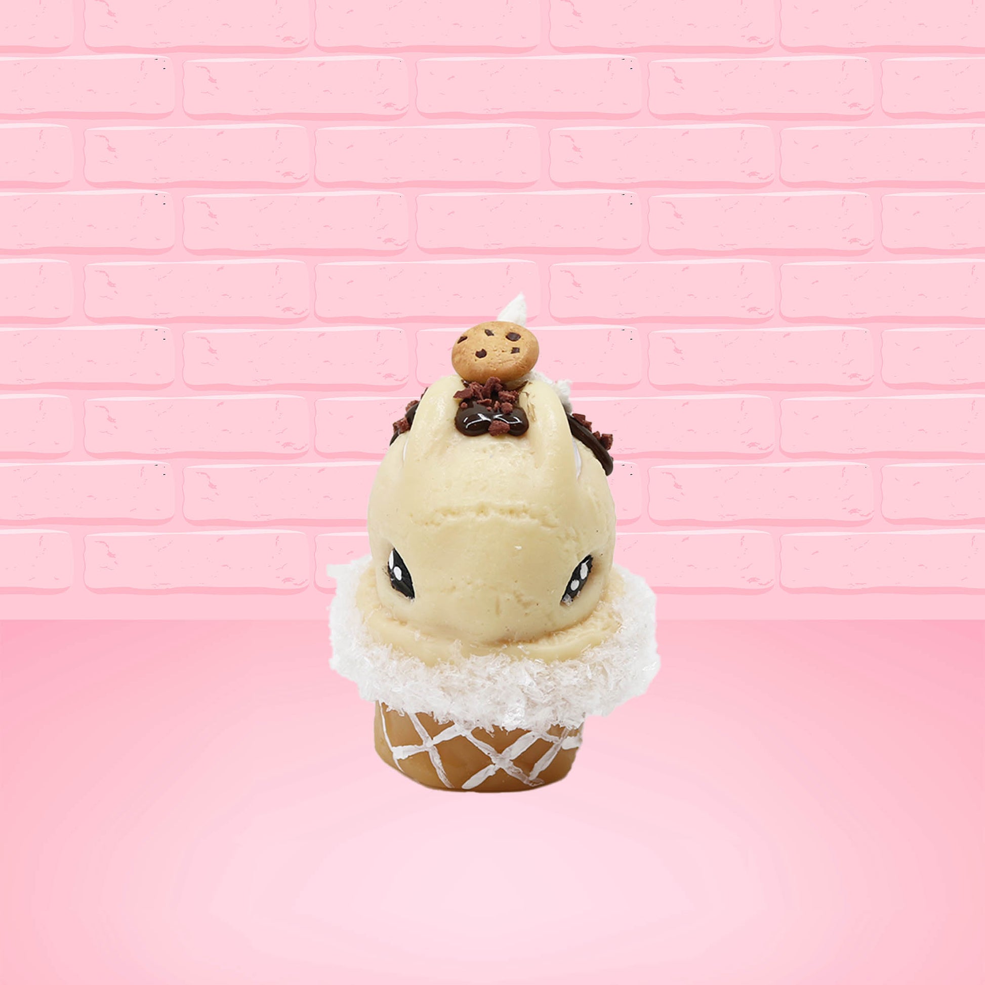 Cute kawaii bunny Cookie Dough ice cream cone with chocolate pieces and drizzle on top of the bunny as well as a cookie near the whipped cream swirl. This view is from the front.