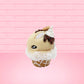 Cute kawaii bunny Cookie Dough ice cream cone with chocolate pieces and drizzle on top of the bunny as well as a cookie near the whipped cream swirl. This view is from the side.