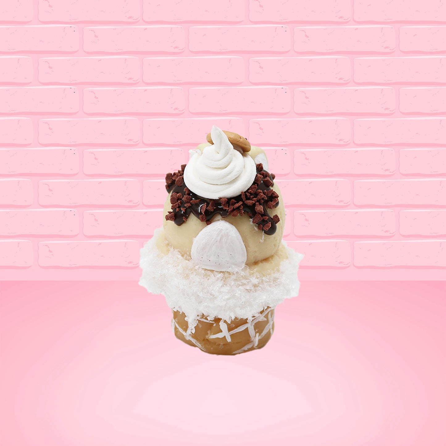 Cute kawaii bunny Cookie Dough ice cream cone with chocolate pieces and drizzle on top of the bunny as well as a cookie near the whipped cream swirl. This view is from the back.