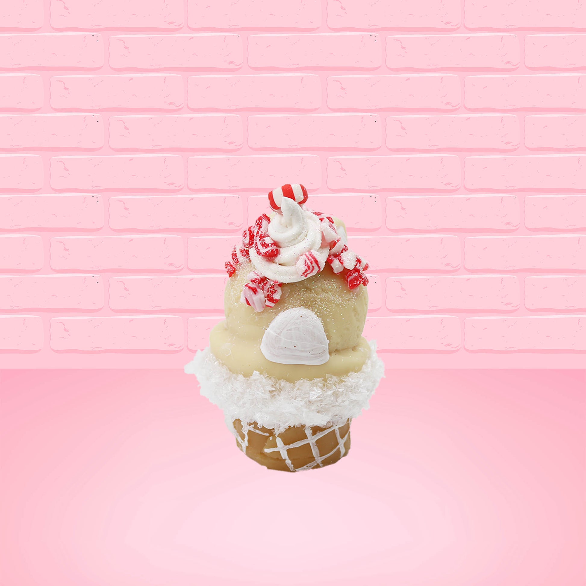 Cute kawaii bunny Peppermint Bark white ice cream with peppermint pieces and a peppermint candy on top of the bunny near the whipped cream swirl. This view is from the back.