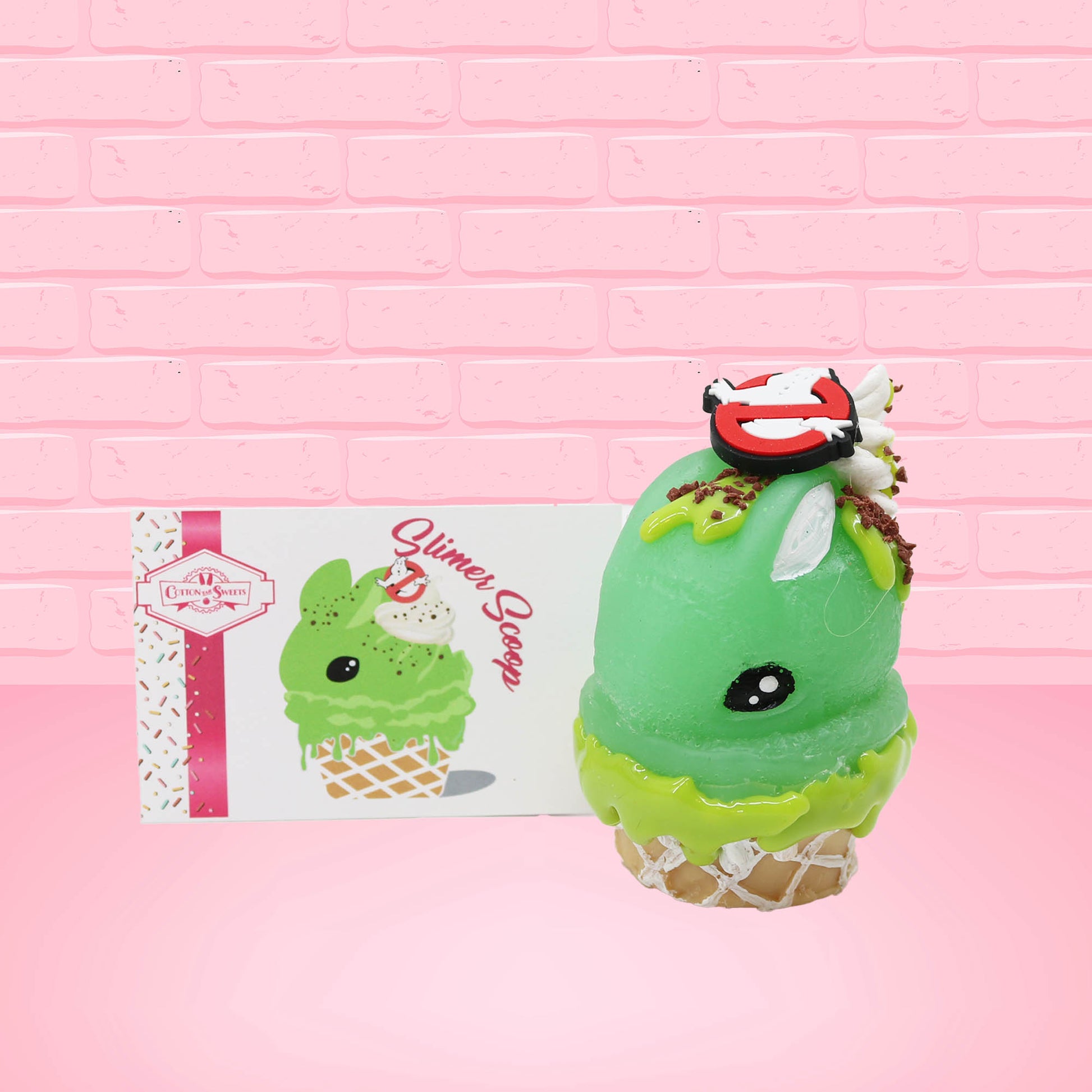 Cute kawaii bunny Slimer Scoop green ice cream cone with green drizzle and brown bits, a ghost buster logo near the whipped cream swirl on top. The front of the character card is shown.