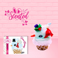 Cute kawaii bunny Snow Bunny light blue ice cream scoop with a carrot nose, red with silver snowflakes ribbon, a black top hat, and holly leaves with berries near the blue glittered whipped cream swirl on the top of the bunny. This view is from the side.