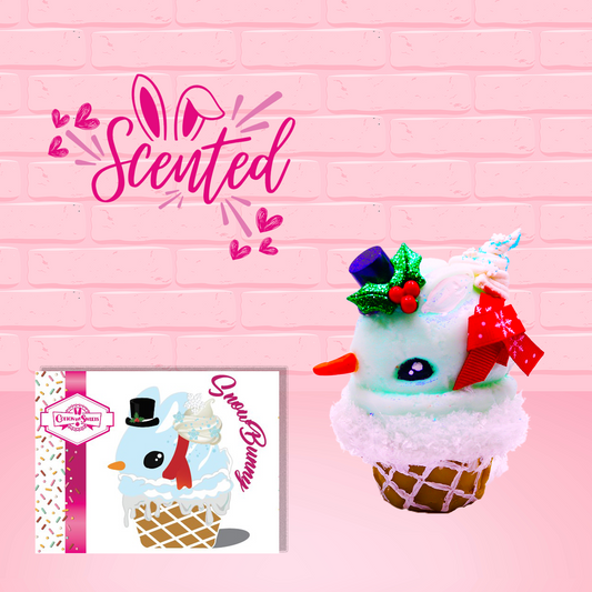 Cute kawaii bunny Snow Bunny light blue ice cream scoop with a carrot nose, red with silver snowflakes ribbon, a black top hat, and holly leaves with berries near the blue glittered whipped cream swirl on the top of the bunny. This view is from the side.