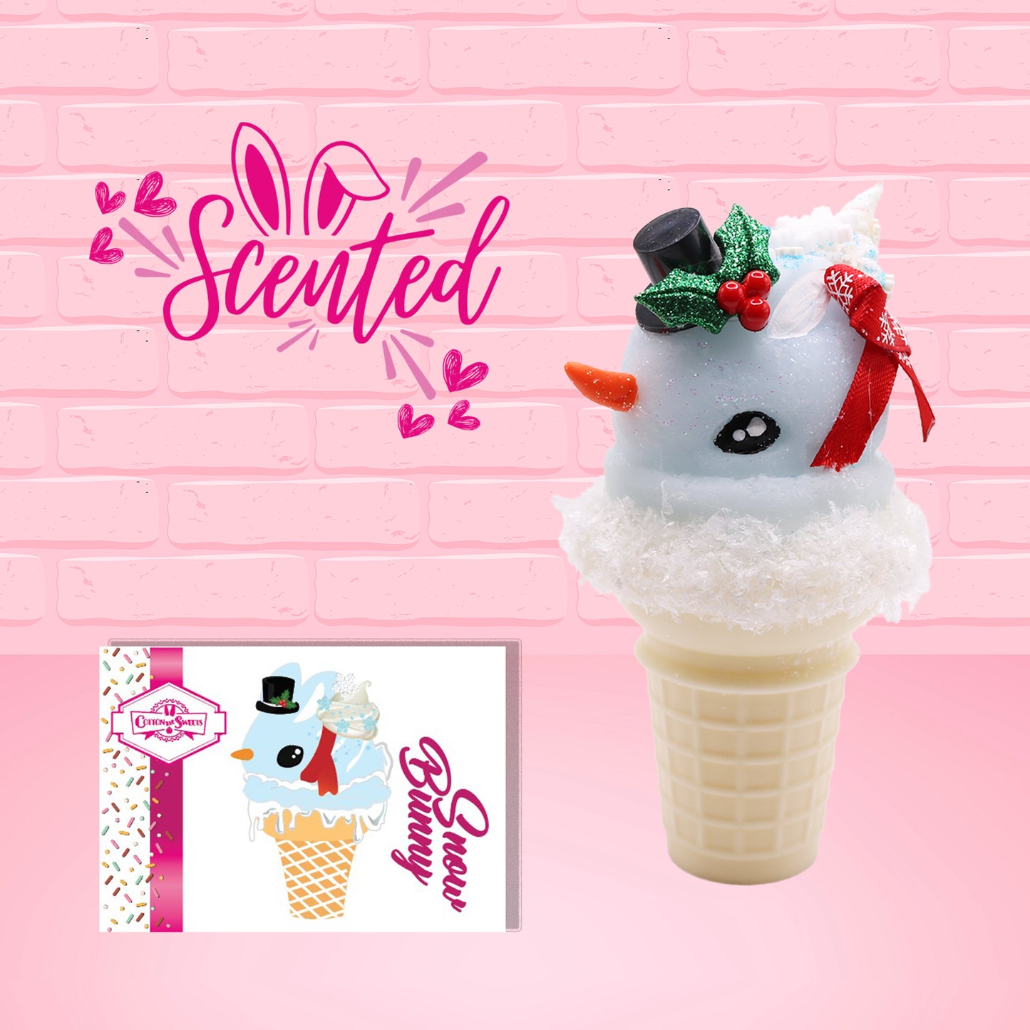 Cute kawaii bunny Snow Bunny light blue ice cream scoop with a carrot nose, red with silver snowflakes ribbon, a black top hat, and holly leaves with berries near the blue glittered whipped cream swirl on the top of the bunny. The front of the character card is shown, as well as the word scented.