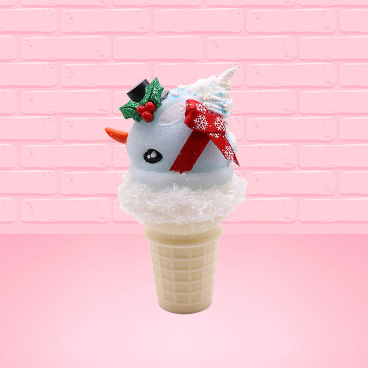Cute kawaii bunny Snow Bunny light blue ice cream scoop with a carrot nose, red with silver snowflakes ribbon, a black top hat, and holly leaves with berries near the blue glittered whipped cream swirl on the top of the bunny. This view is from the side.