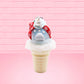 Cute kawaii bunny Snow Bunny light blue ice cream scoop with a carrot nose, red with silver snowflakes ribbon, a black top hat, and holly leaves with berries near the blue glittered whipped cream swirl on the top of the bunny. This view is from the back.
