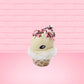 Cute kawaii bunny white ice cream cone Vanilla Pink Sprinkle with black and pink sprinkles on top with a swirl of whipped cream. This view is from the side at an angle.